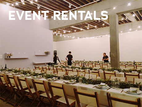 A group of people setting up an evenet with the text Event Rentals